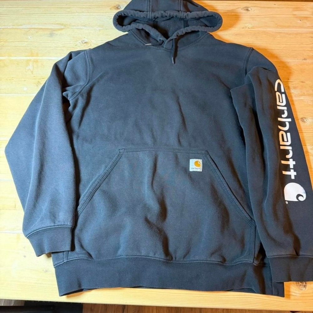 Black Carhartt hoodie with white logo on sleeve. Medium Loose.
